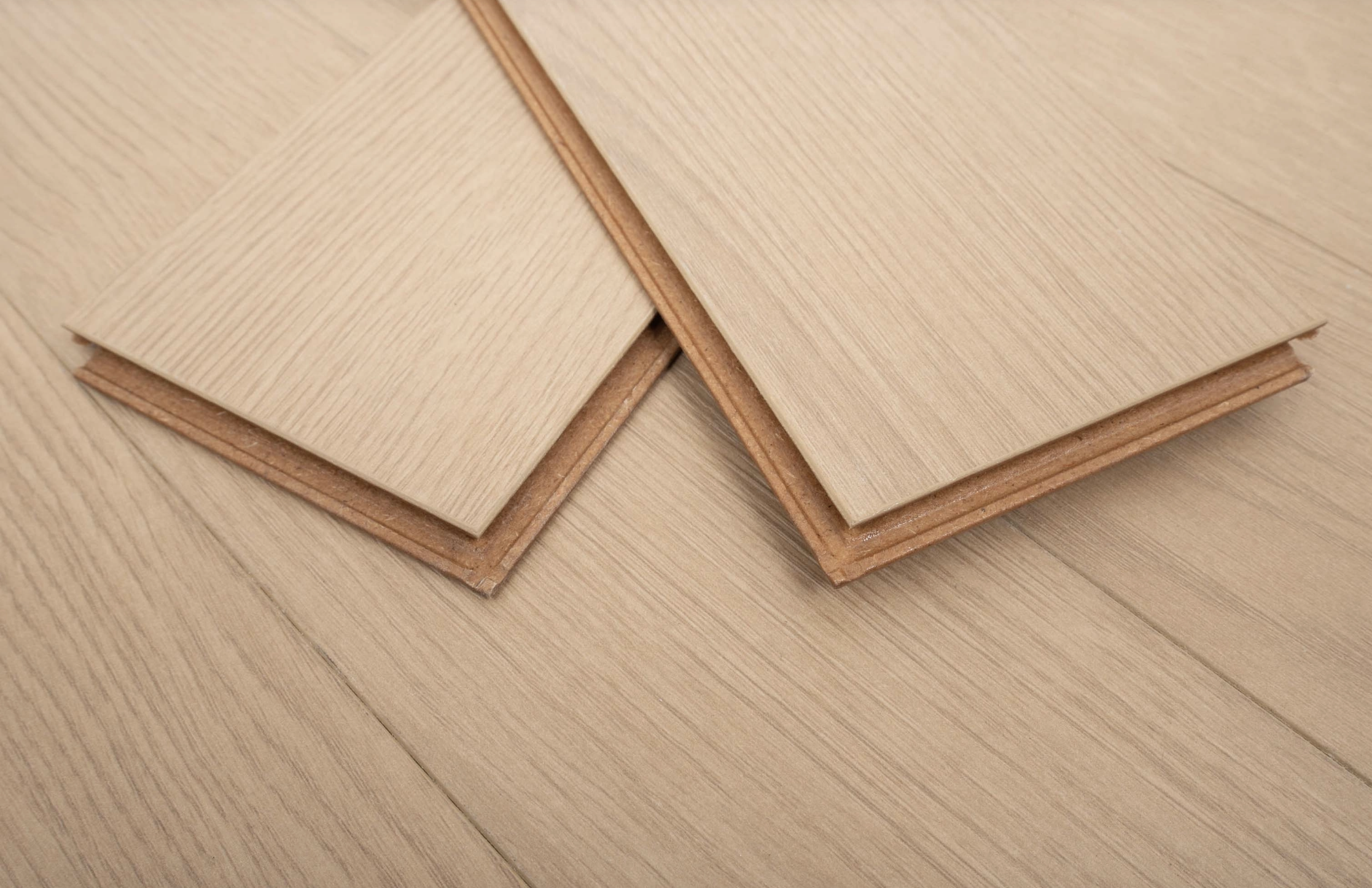 Natural Honey Brown 8mm Herringbone Laminate Floor | 1.8m² Pack Coverage